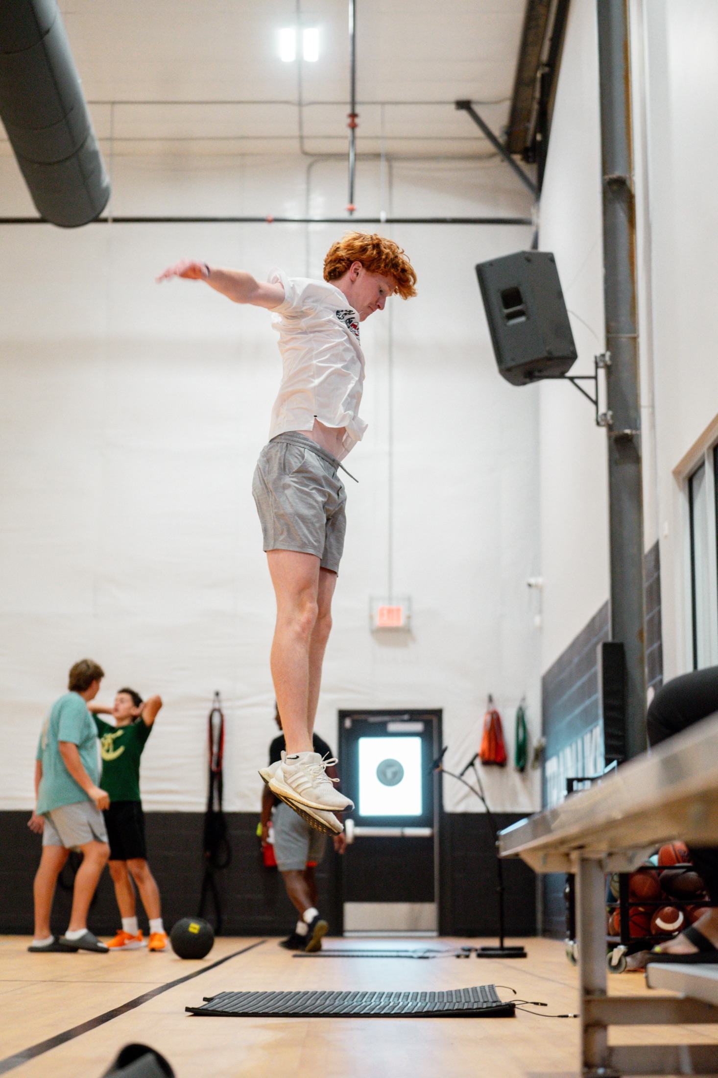 Athlete rebounding off a Plyomat mat during a group session